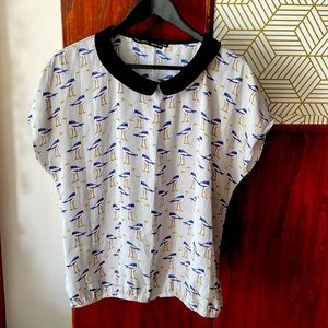 Zara Peter Pan collared blouse with bird design.